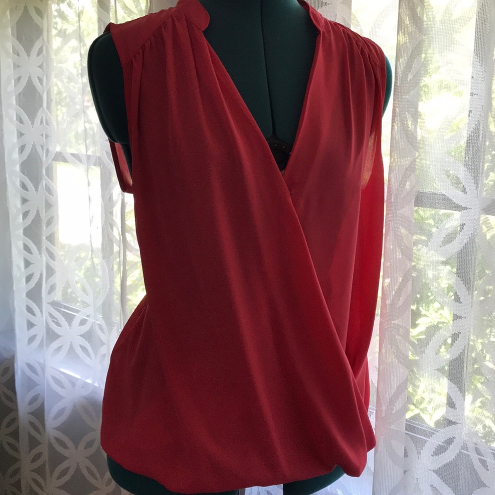 Salmon colored sleeveless blouse